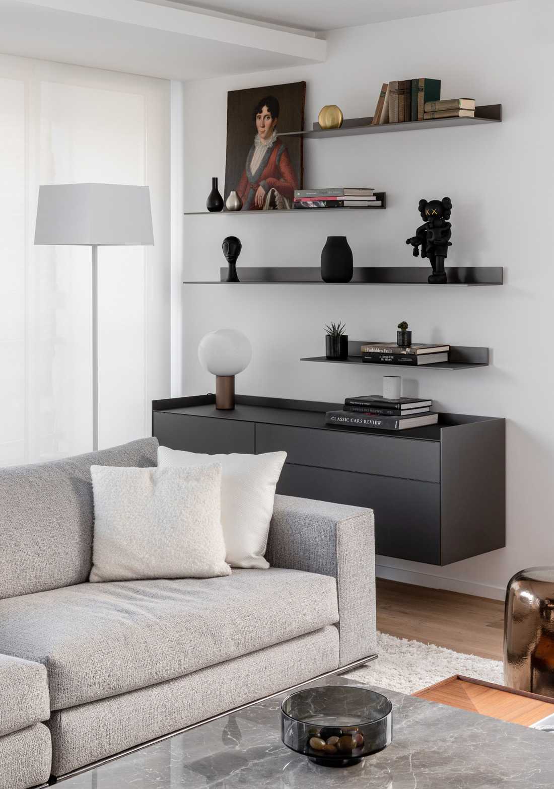 Canapé Minotti dans le salon d'un appartement rénové par un architecte d'intérieur dans le Nord