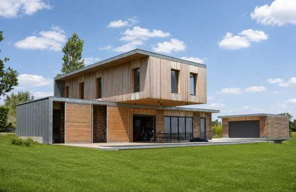 Réalisation d'une maison individuelle contemporaine avec bois et béton dans un esprit Loft par un architecte à Lille.